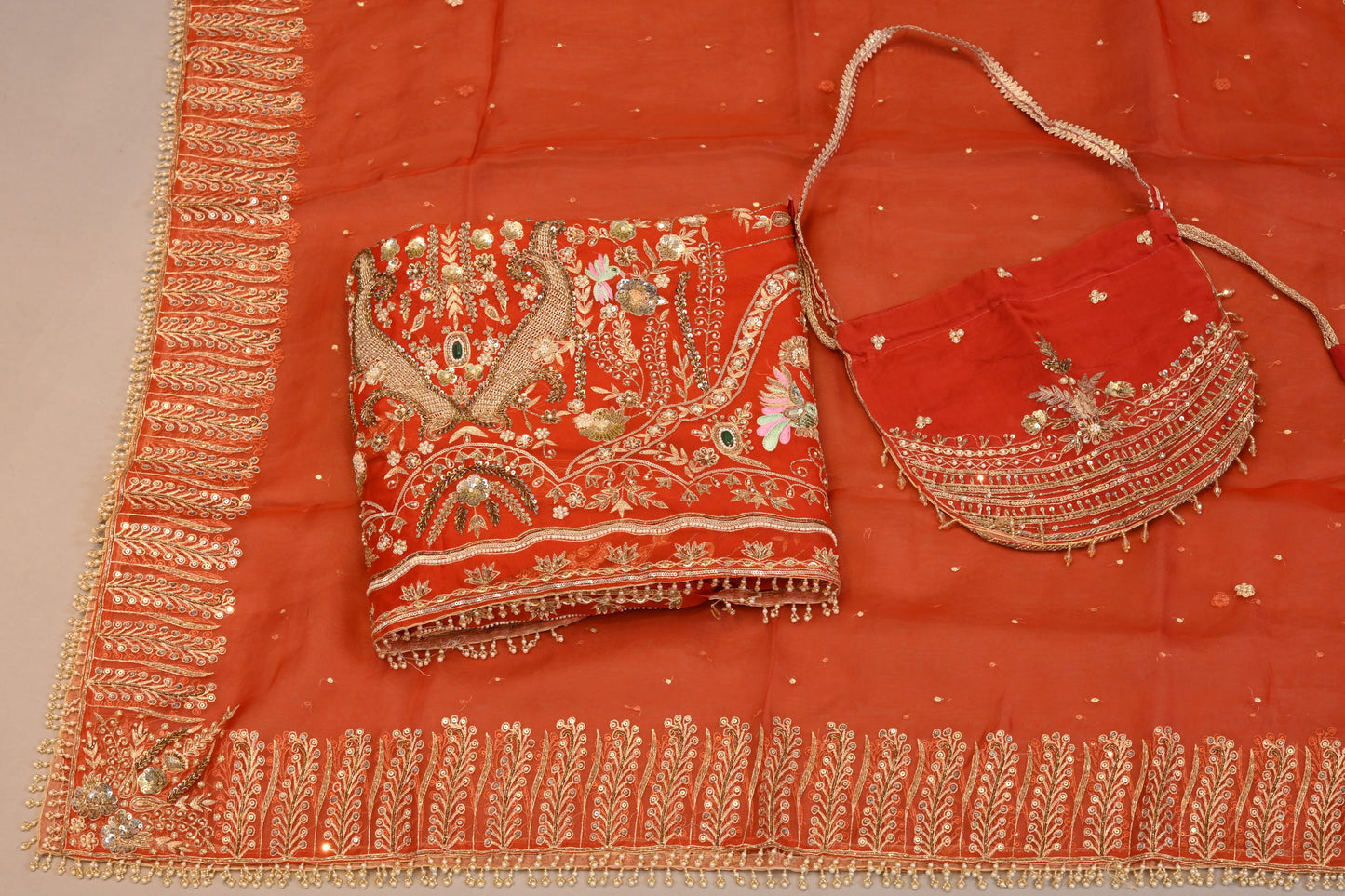 Coral Orange Suit dupatta Hand-Embroidered Bridal Ensemble with Potli Bag